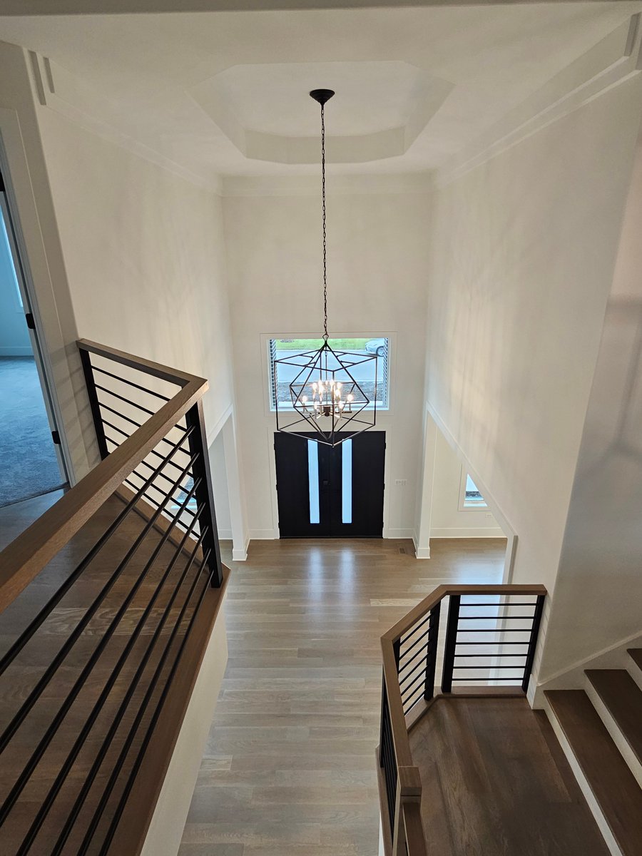 Beautiful view of a #frontentryway from the 2nd floor! Our #modelhome is open from 11 am - 5 pm at 4012 Alfalfa Ln #Naperville #newhome #newhomedesign #newhomebuilder #newhomeconstruction #homebuilder #homeconstruction #customhome #customhomebuilder #customhomebuild #newhomebuild