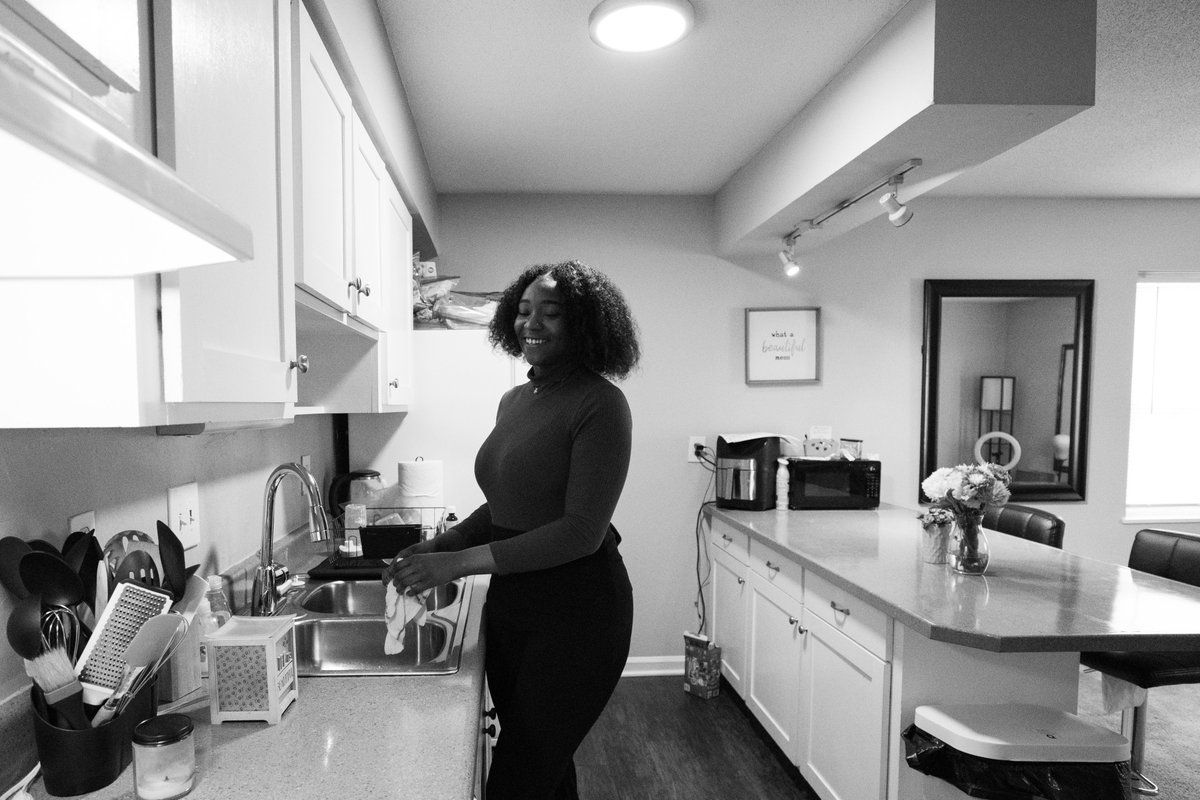 Wonder where Lotus came from? Lotus flowers symbolize hope and the promise of regeneration. The kind of regeneration Lotus Campaign is working to create for individuals and communities. Pictured: Destiny, sponsored resident, in her new apartment home in #Raleigh.