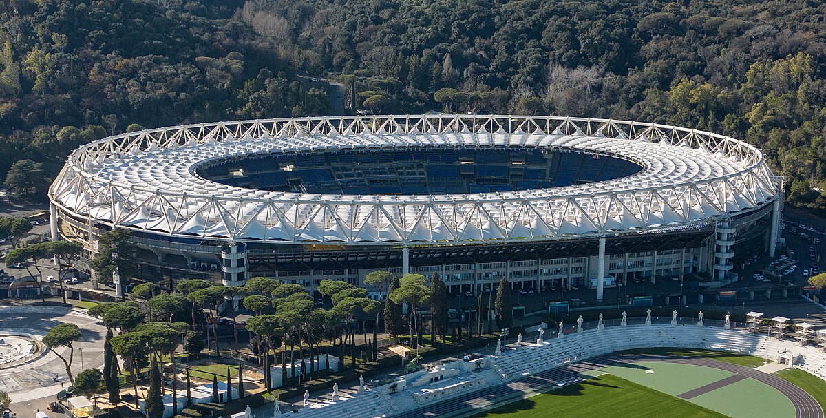 Looking up while seated in @ASRomaEN's home at the Stadio Olimpico can feel like you're in a forest. Look for the Madonna di Monte Mario hidden in the hills, as she watches over all