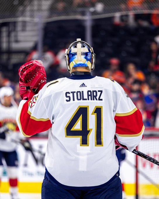 Photo of Panthers goaltender Anthony Stolarz on the ice in his white road uniform.