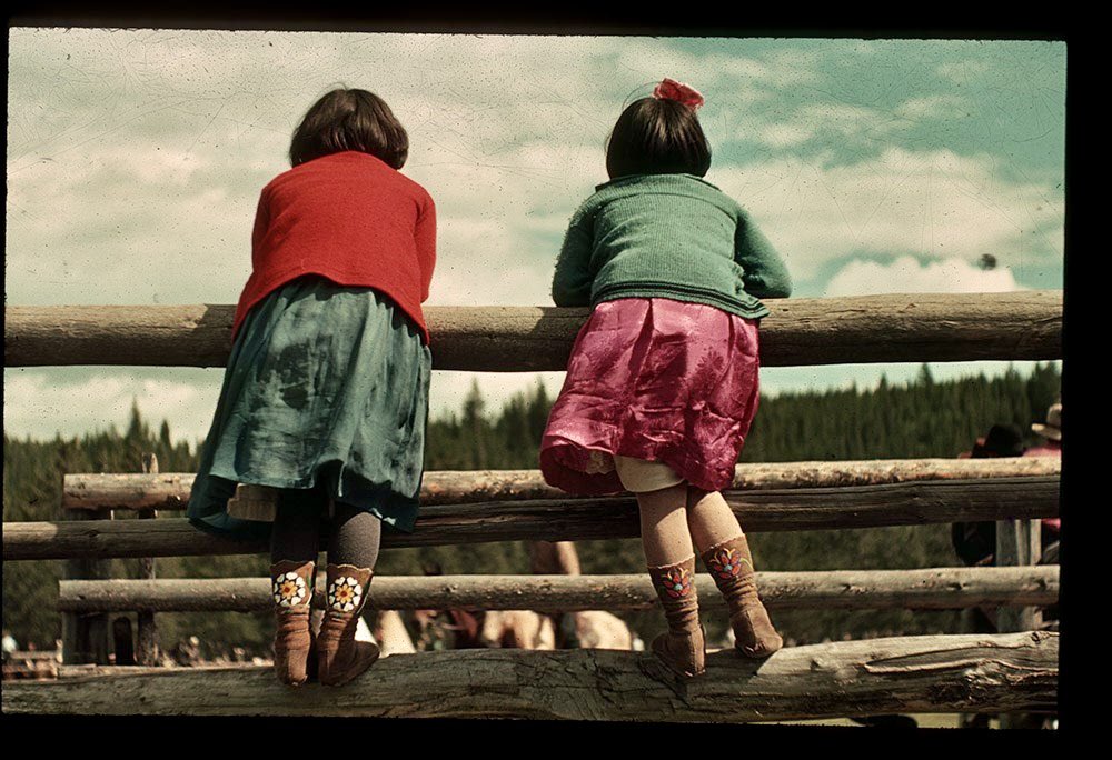 Two girls watching the rodeo. Photographed during Banff Indian Days, 1950s. 📷 Peter & Catharine Whyte | Whyte Museum of the Canadian Rockies