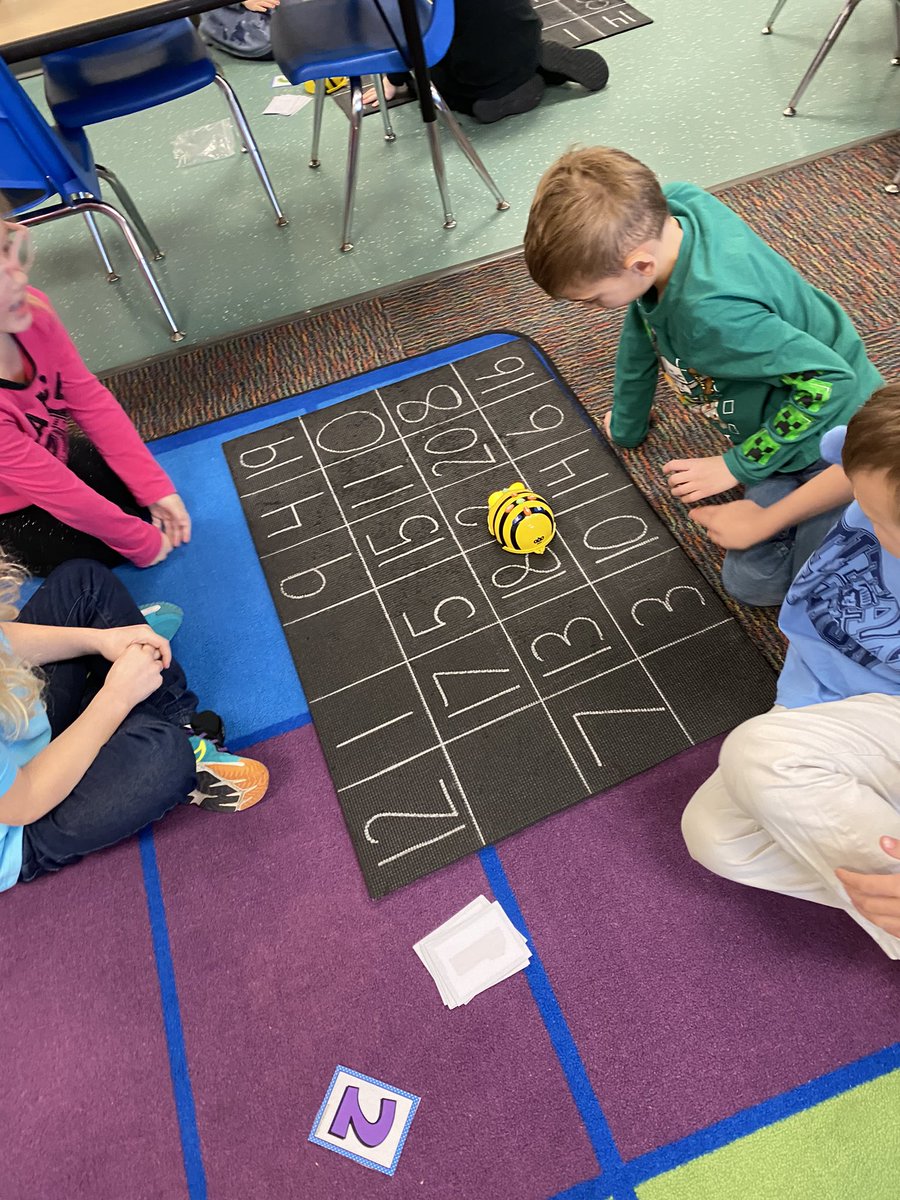 Today one of our math groups drew a number 0-10 and added it to a group of 10. So they had 10 and ___more. Then they had to code their BeeBot to that teen number they made! #kinderchat #CodeBreaker