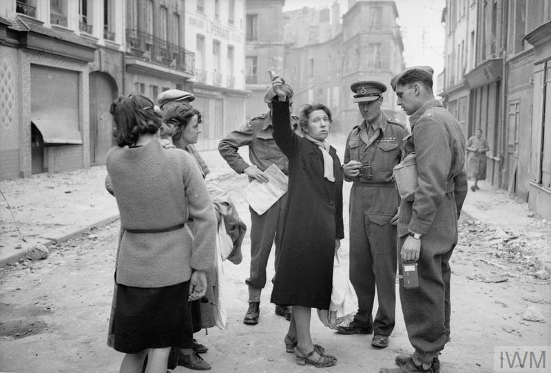 Lt-Gen John Crocker, Commander of I Corps, talking to civilians in Caen, Normandy, 10 July 1944. To Crocker's right is (I think) his ADC, Captain John Cross; to his left (with camera) is Major Hugh Stewart, o/c of 5 AFPS. IWM B 6779, Capt. Malindine, AFPU iwm.org.uk/collections/it…