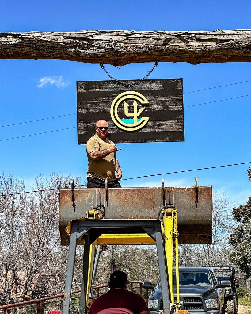 CKIVFoundation's tweet photo. Ranch improvements underway 🚜🚧 Thank you @angelcityoutlaw @planksandanchors for our new C4 sign hanging at the ranch entrance to welcome our SEAL families!
#NavySEALFamilies #C4Foundation #militarycommunity #C4Ranch #planksandanchors #woodwork https://t.co/OkzSKTohs5