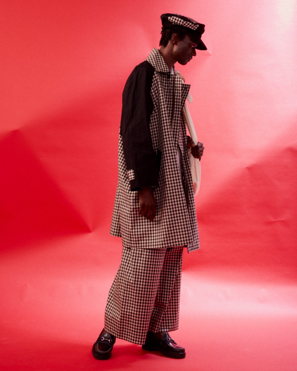 New SS24 styles are now available at nicholasdaley.net. “Signature gingham checks have been reworked into a voluminous wide leg trouser, a 2-pocket shirt, and the iconic raglan sleeve oversized raincoat, all made in England using mixture of Italian and U.K. woven fabrics.”