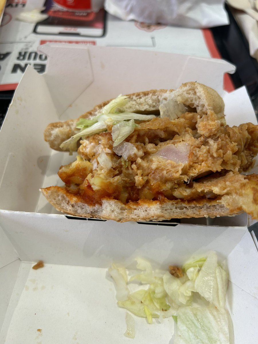 KellyMayyy's tweet photo. @kfc @KFC_UKI 
Absolutely shocking- RAW  chicken burger. No refund offered to us to be told that the chicken is normally cooked… well I’d hope so 😩 https://t.co/T1GlVG3bQm