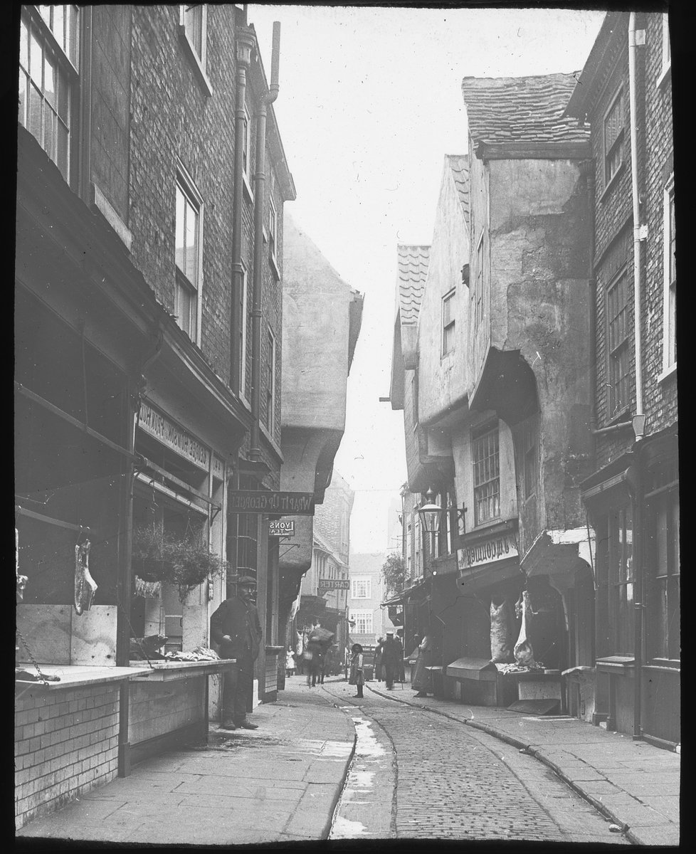 Yesterday we asked if you could recognise this street... It's The Shambles of course! 📷 The first picture was taken c.1895. 📷 Look closely in the second picture and you can see the many butchers shops that lined the Shambles, taken sometime in 1930s.