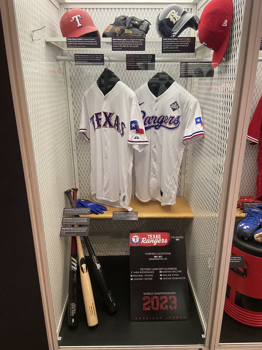 The Rangers team locker at the National Baseball Hall of Fame and Museum in Cooperstown, NY. That’s Adolis Garcia’s jersey from Game 1 of the 2023 World Series when he had the game-winning walk-off homer. The other jersey is Michael Young’s from 2000th hit game in 2011.