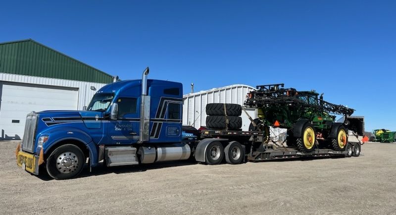 We brought this sprayer from SK to ON last week.    We will have RGNs in AB + SK this week as well.   #farmersfeedcities #transportation #oversized #kenworth #johndeere