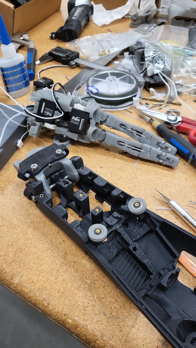 Testing out the latest prints. It's amazing how colour coordinating the materials can make you look like you mean business. This is the new forearm and palm rev going together. Hoping this is our final spin before retolerancing everything for SLS printing.