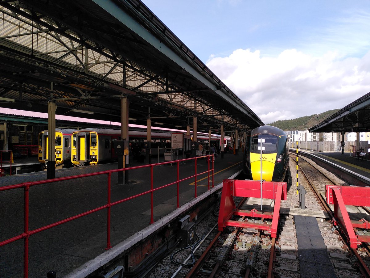 Tour Day 31 Railway Station 47. Swansea/Abertawe. The culmination of a long and idyllic journey from Crewe, the Gateway To The Gower is neat, humble, a little cramped in its concourse but with platforms open to forests and sky. Plus cool bilingual arrow porch out the front!