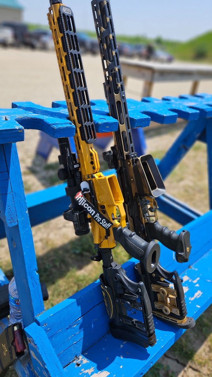 Spotlight on Jay Carillo's competition setup. On the right is his Dissident Arms shotgun mounted with an SRO—perfect for rapid target engagement. The one on the left is an ADM rifle with a 1-6x24 Credo complemented by an SRO offset, ready to transition and bridge the gaps.