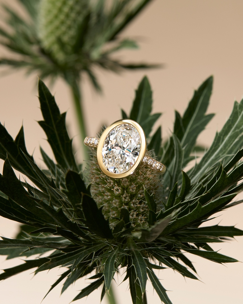 Designed for the modern bride, this Florentine engagement ring features brilliant cut diamonds in a Single Mine Origin gold halo, setting the main oval diamond in place. ⁠ #Boodles #Florentine ⁠