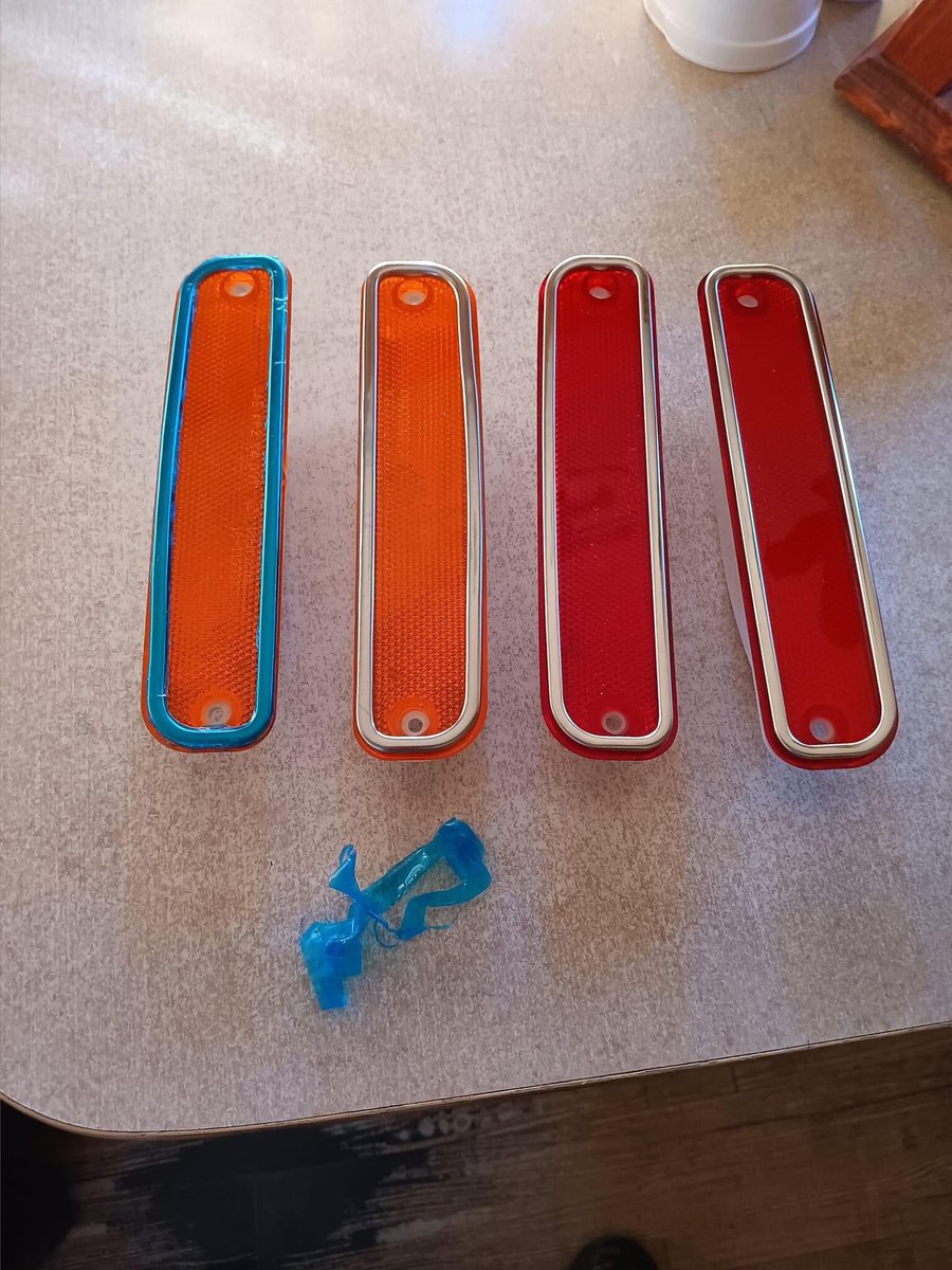I laughed a great laugh until the roof rafters shook. You see those amber side marker lites? They were supposed to have chrome trim around them and when I got them they were blue. I was about to send them back. I had them packaged up and everything, and then I decided to keep