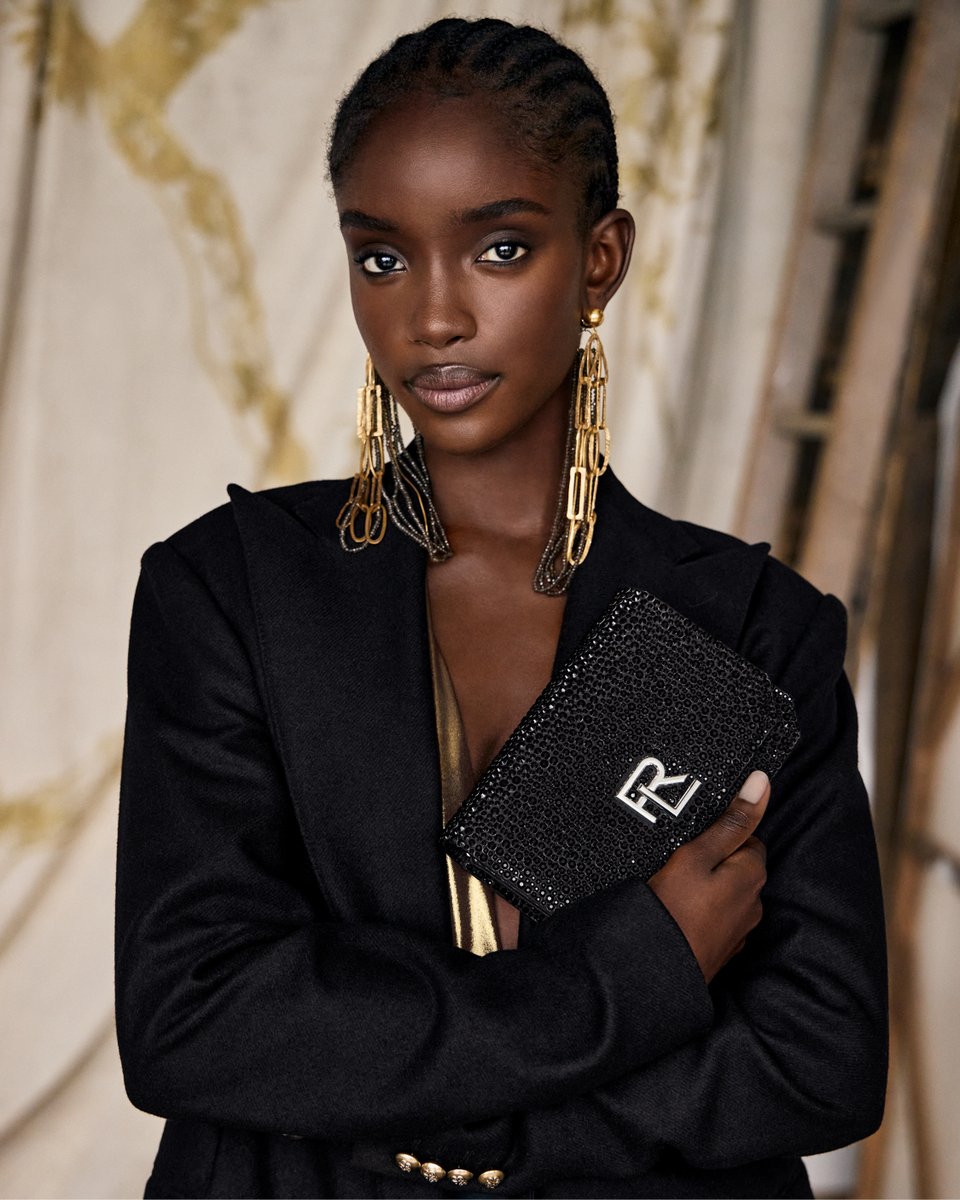 Juxtaposed with gold drop earrings, the #RLSP24 #RL888 glimmers with starry crystals on a silk satin base. Discover the RL 888 Embellished Mini Crossbody Chain and #RLCollection accessories: rlauren.co/CollectionSpri…
