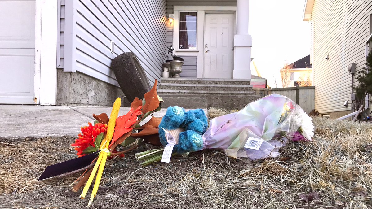 Neighbours have made a small memorial for the boy who was killed by dogs in south Edmonton. A cleaning crew brought out a dog-bowl stand that appeared to have blood stains on it. #yeg edmonton.ctvnews.ca/boy-killed-by-…