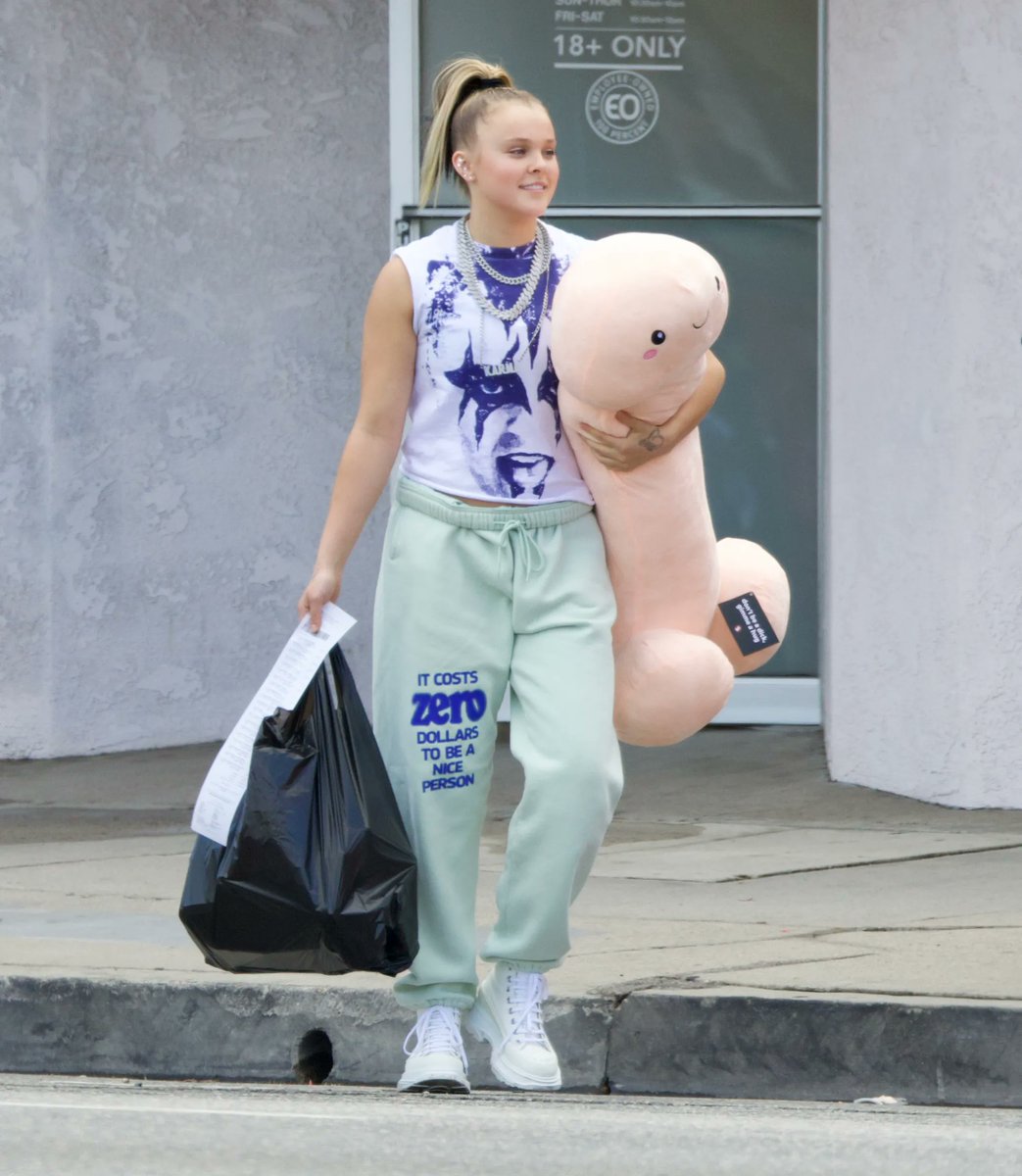 kirkpate's tweet image. only jojo would stage a pap walk in front of a sex shop and leave holding a plushie.........