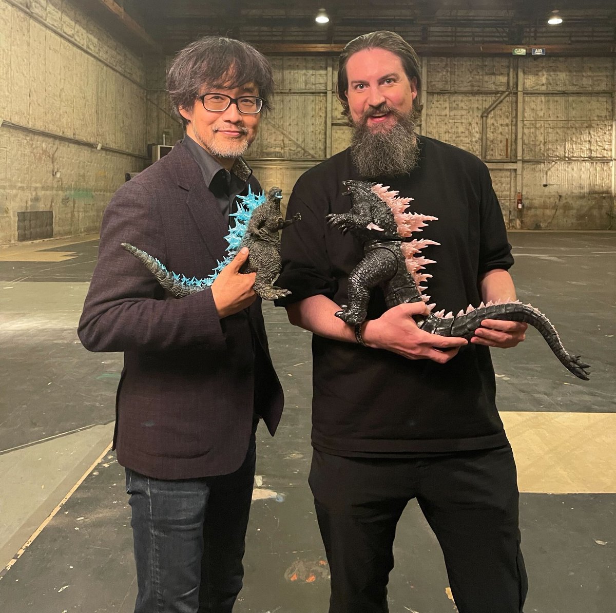 Takashi Yamazaki and Adam Wingard hanging out with their Godzillas. 🩵🩷