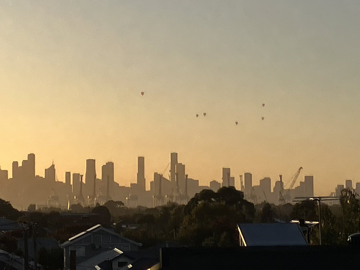Beautiful morning in Melbourne- the dots are hot air balloons rising over the city