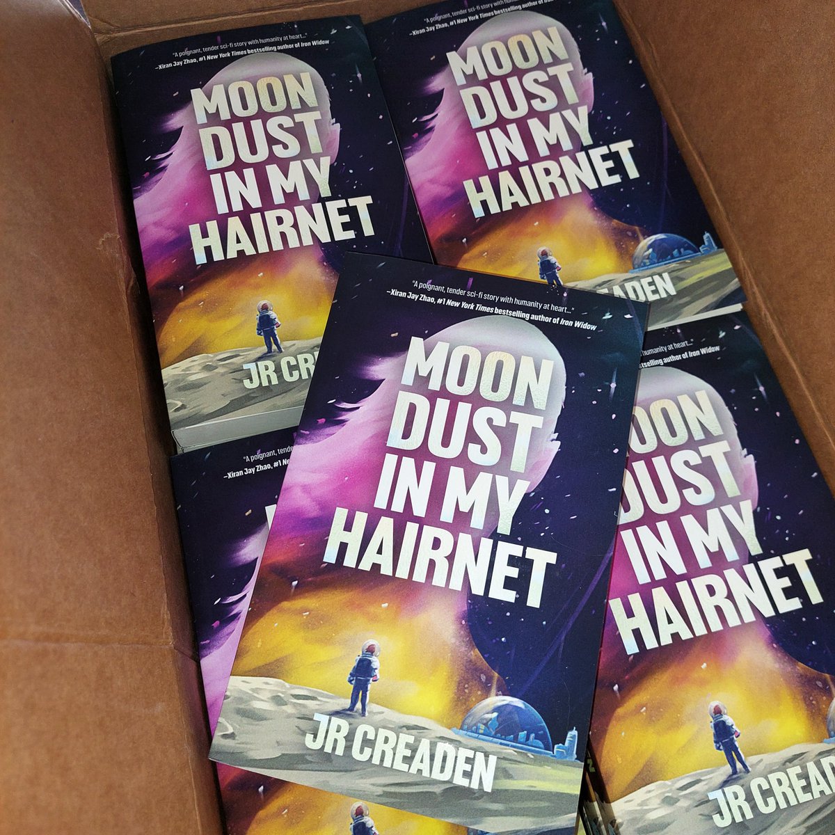 Copies of Moon Dust in My Hairnet by @JessCreaden have arrived from the printer! So excited to start shipping out pre-orders very soon!! 🎉🤩

#2024debuts #scifibooks #bookmail #lgbtqbooks #neurodiversereads #bookstoread