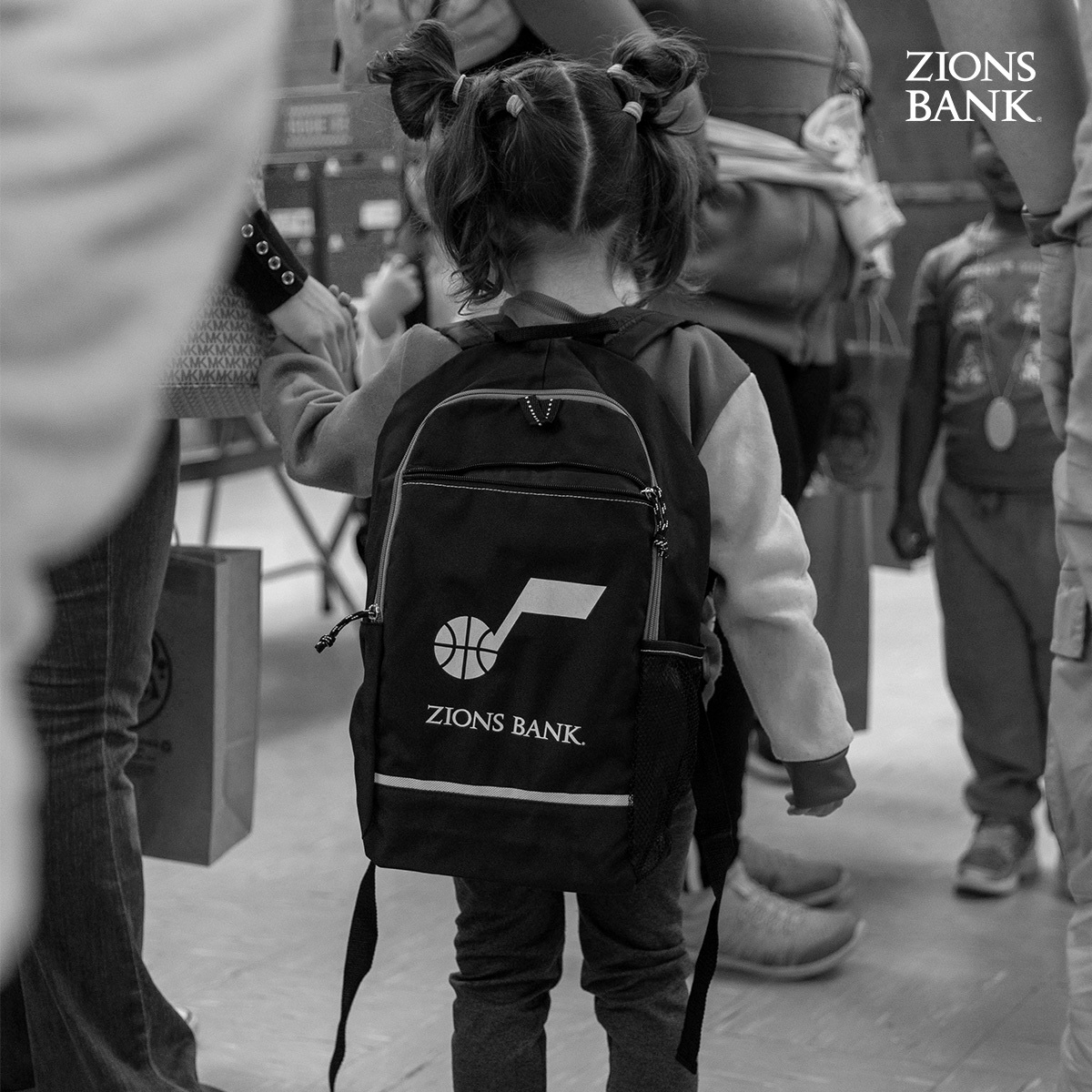 It’s more than basketball. We had the opportunity to partner with @ZionsBank to donate shoes and backpacks to families in our community. This is why we play 🖤 #CommunityObsessed | @ZionsBank