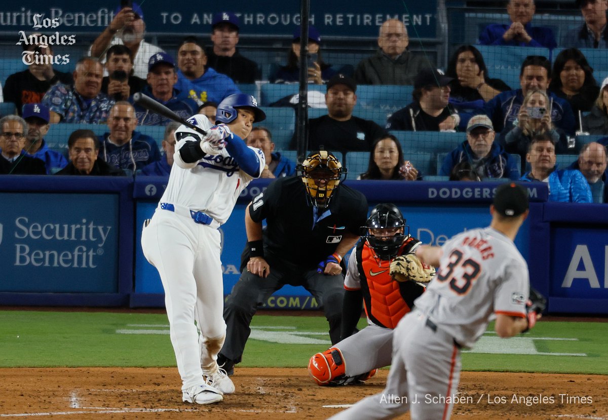 Dodgers designated hitter Shohei Ohtani hits his first home run as a Dodger off of Giants pitcher Taylor Rogers in the seventh inning at Dodger Stadium. @latimes @latimessports #Dodgers #ohtani