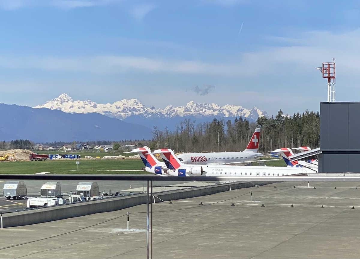 konorth's tweet photo. The business lounge at Ljubljanica ‘s airport is small but has nice amenities. Lockers for carryons,a small rest area and an open but covered  airside deck with great views of the Julien Alps and runway. https://t.co/De7RhZ0JeR