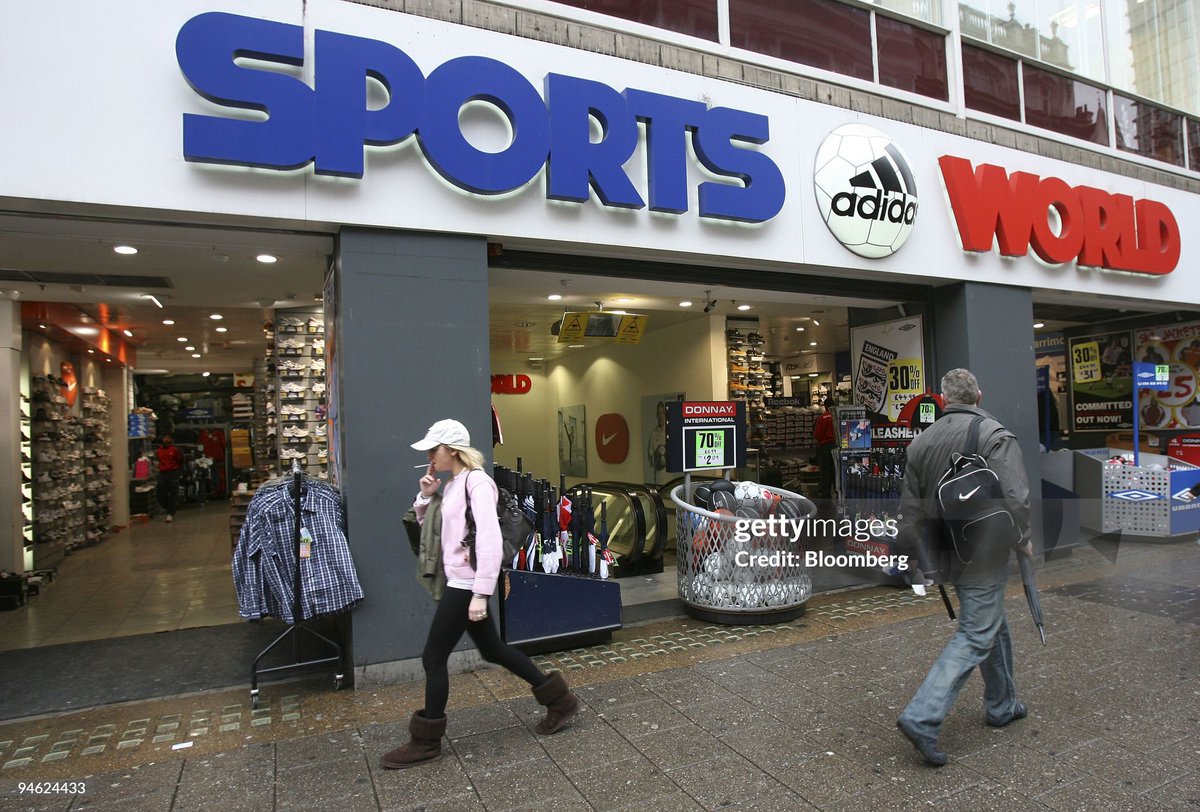 Pedestrians pass by a Sports World shop on Oxford Street in London (2007)