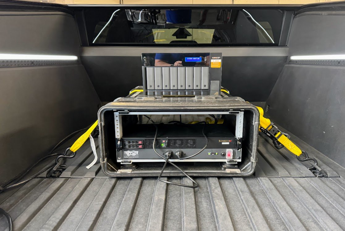 Road testing which is better for mobile storage. A @Solidigm 61.44TB SSD + 2x boot SSDs in the @Supermicro_SMCI 1U vs 8x 10TB HDDs (@QNAP_nas Velcro'd in the @PelicanProducts Hardigg case). The @cybertruck outlets can power while driving. Guess which fails 1st SSD or HDD and when