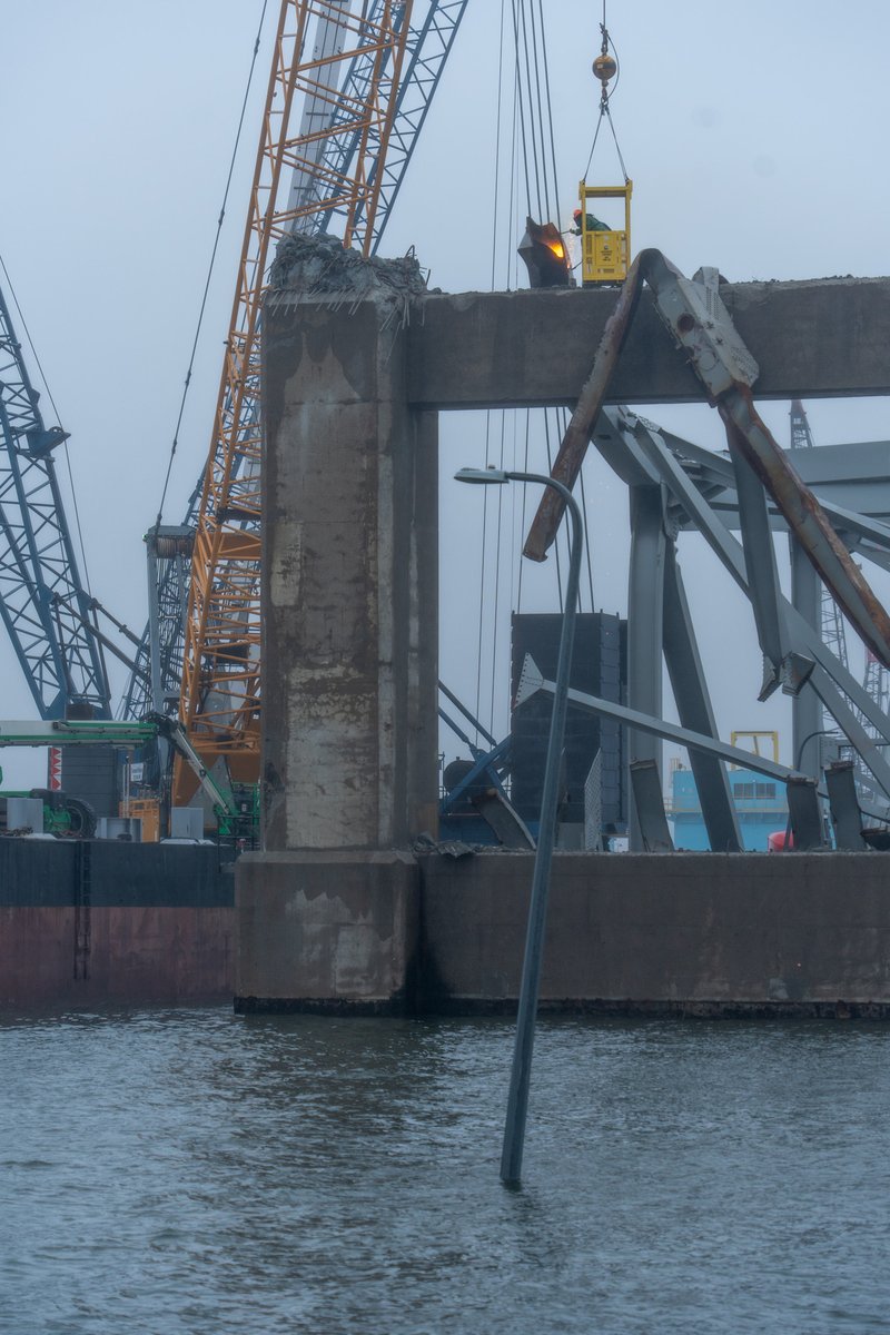 Highly trained salvage operations personnel use an exothermic torch to cut off a portion of the collapsed Francis Scott Key Bridge, April 2, in Baltimore, MD. Once separated from the structure, the smaller sections of the steel bridge will be moved to a disposal site. 1/2