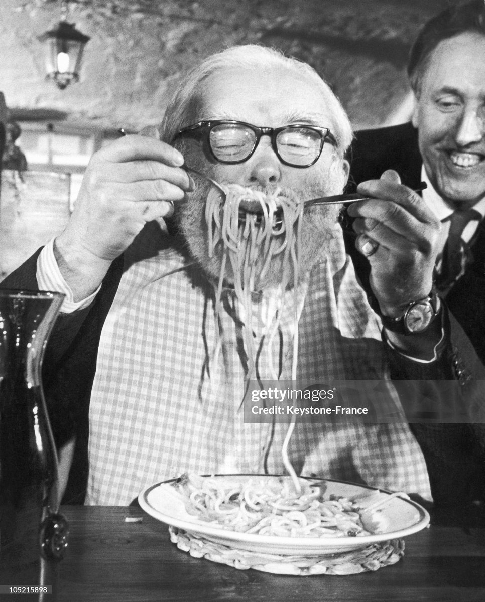 One Of The Competitors Eating His First Plate Of Spaghetti At Alpino Restaurant In Leicester Square, London (1967)