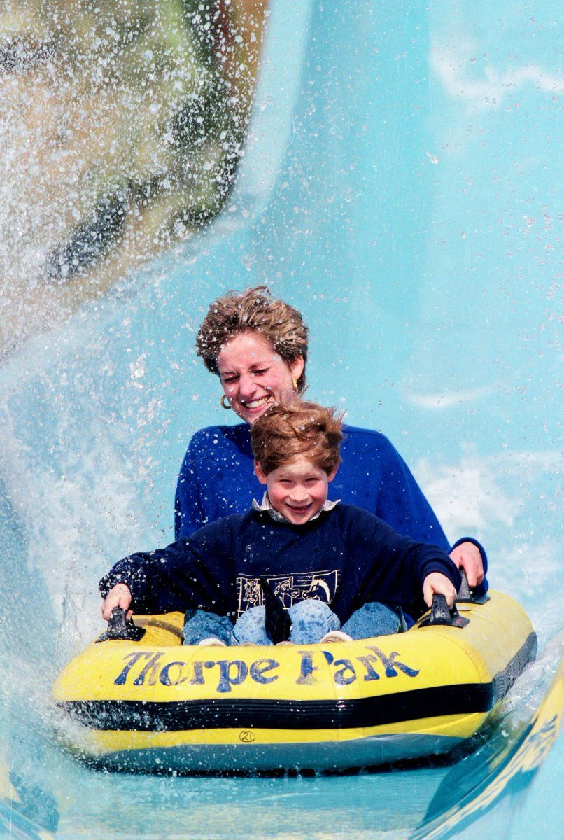 Princess Diana on a water slide with her son Harry at an amusement park in 1992