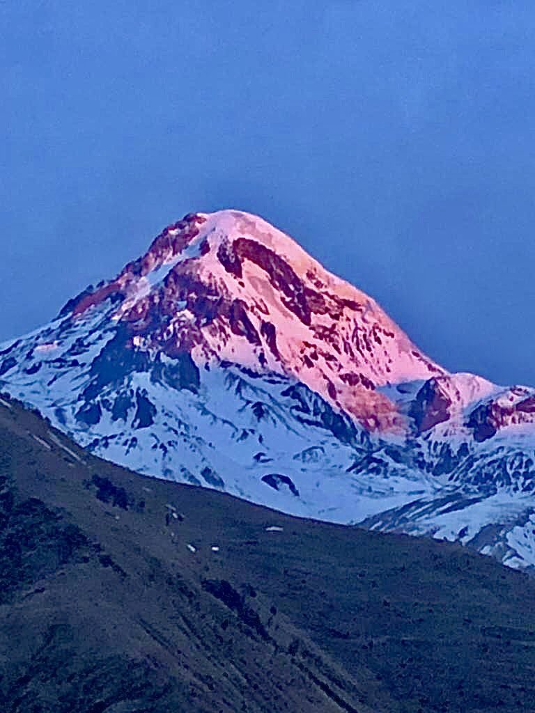 Pangolin365's tweet photo. One year ago today I was in Georgia, specifically in Stepmantsminda looking for Caucasian Snowcock and Caucasian Grouse, which we successfully saw on the slopes of the Caucasus Mountains. Early morning sunrise on Mt. Kazbek overlooking Stepmantsminda, a spectacular view https://t.co/WKW3rO7cml