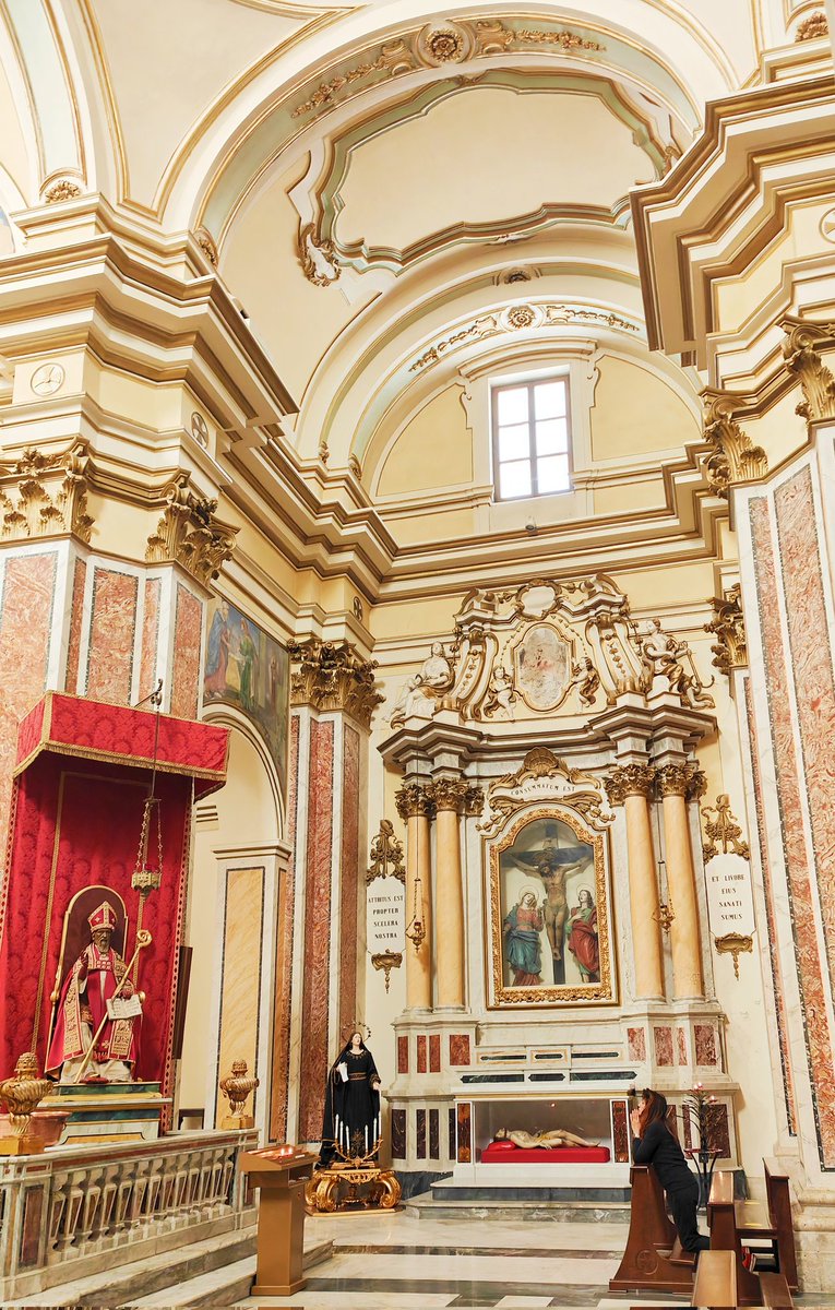 We do all sorts of things when our personal life is in turmoil. A woman in her intimate moment with her faith in a catholic church in Italy.