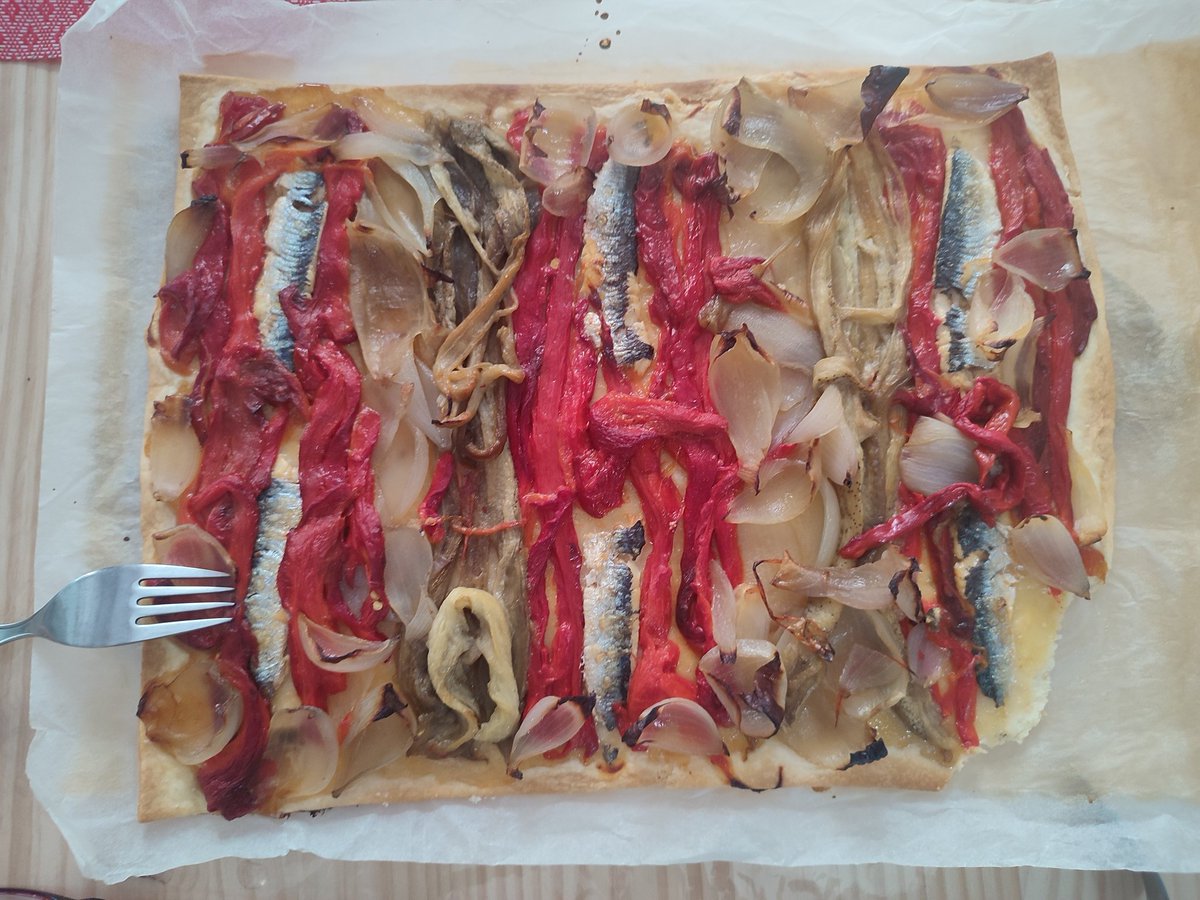 Delicious ' coca de recapte ' for lunch by @BCNwildlife. Roast red peppers, aubergine and onions with sardines on a very thin base. Origins in Lleida and Tarragona