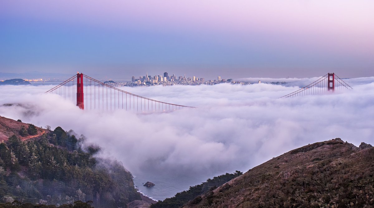 ‘Sentinels in the sky’ by @dollykabaria dropping shortly on @drip_haus The twin towers of the Golden Gate Bridge solemnly stand guard through clouds and clear weather, calmly holding up the passage to the modern-day ‘El Dorado.’