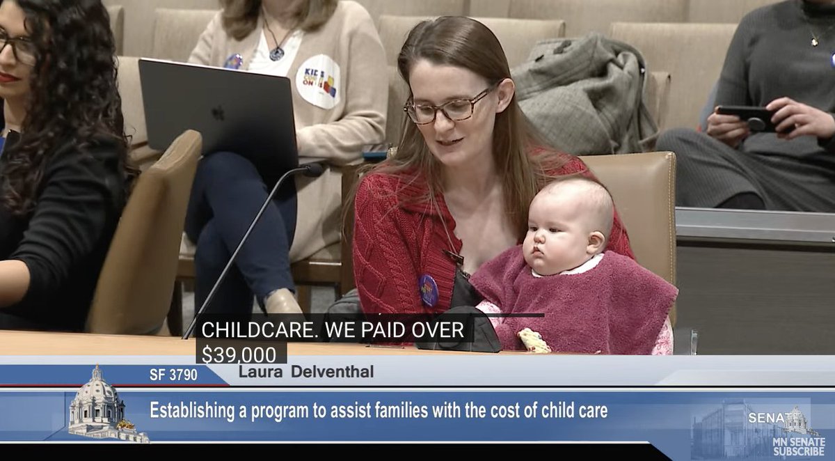 Parent @DelventhalLaura testifying on childcare affordability with her 5 month old (and 5 and 8 year olds). 'We paid over $39,000 per year [for childcare], a far cry from Minnesota’s stated goal of no more than 7% of a family’s income...' #affordablechildcare #mnleg