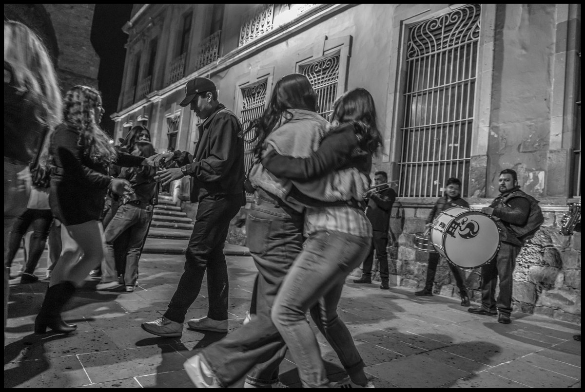 Young people dancing in the street at night in Zacatecas - photographs by David Bacon flickr.com/photos/5664665…