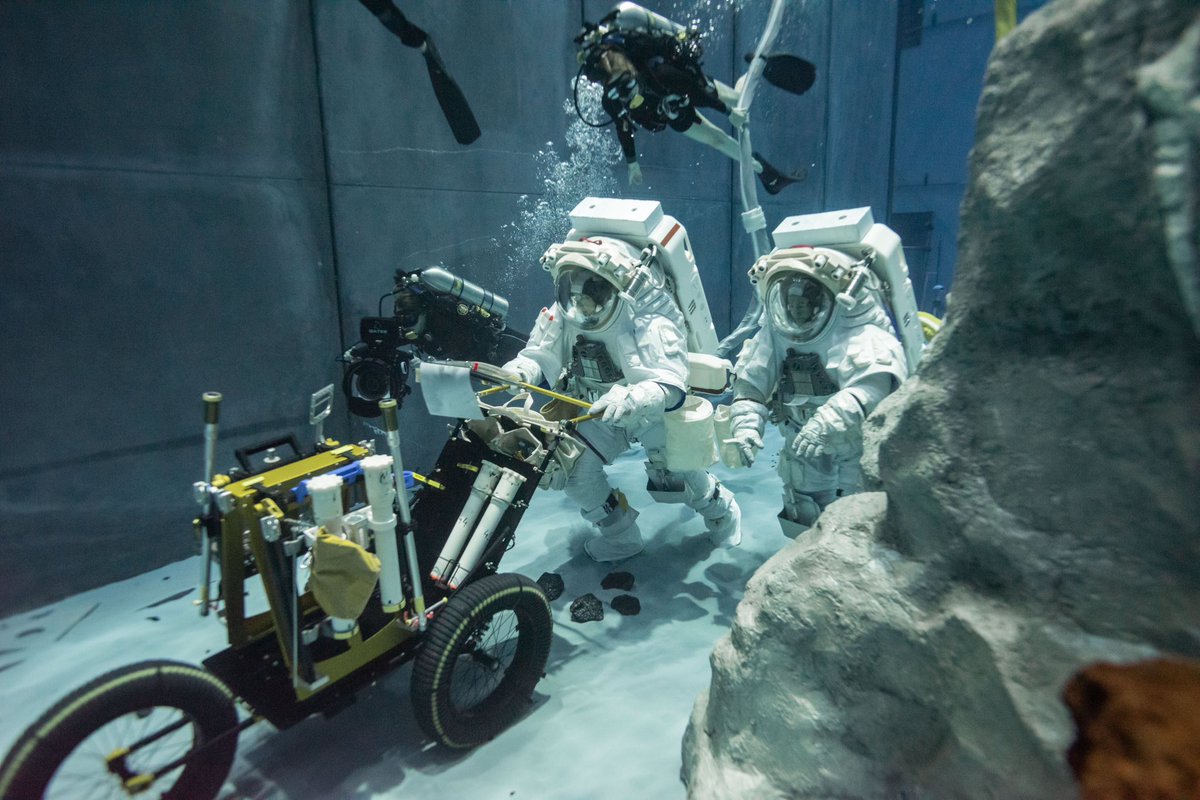 A glance of a recent test at the @NASA_Johnson #neutralbuoyancylab evaluating lunar spacesuits for future @NASAArtemis missions. @AstroKomrade and I practice pushing our tool cart, taking geologic samples, and conducting experiments on a simulated Moon surface - just another day