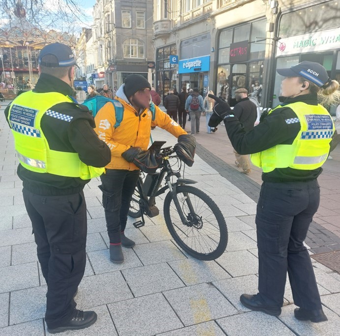cardiffcouncil's tweet photo. Our City Centre Warden team joined forces with @SWPolice to crackdown on cyclists &amp; riders that do not comply with the no-cycling rule along Queen Street.

Between Jan-March, #OpCastor has seen 342 cyclists stopped &amp; advised on the dangers of cycling in pedestrianised areas. https://t.co/WD45PLKafE