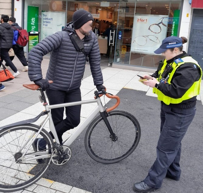 cardiffcouncil's tweet photo. Our City Centre Warden team joined forces with @SWPolice to crackdown on cyclists &amp; riders that do not comply with the no-cycling rule along Queen Street.

Between Jan-March, #OpCastor has seen 342 cyclists stopped &amp; advised on the dangers of cycling in pedestrianised areas. https://t.co/WD45PLKafE