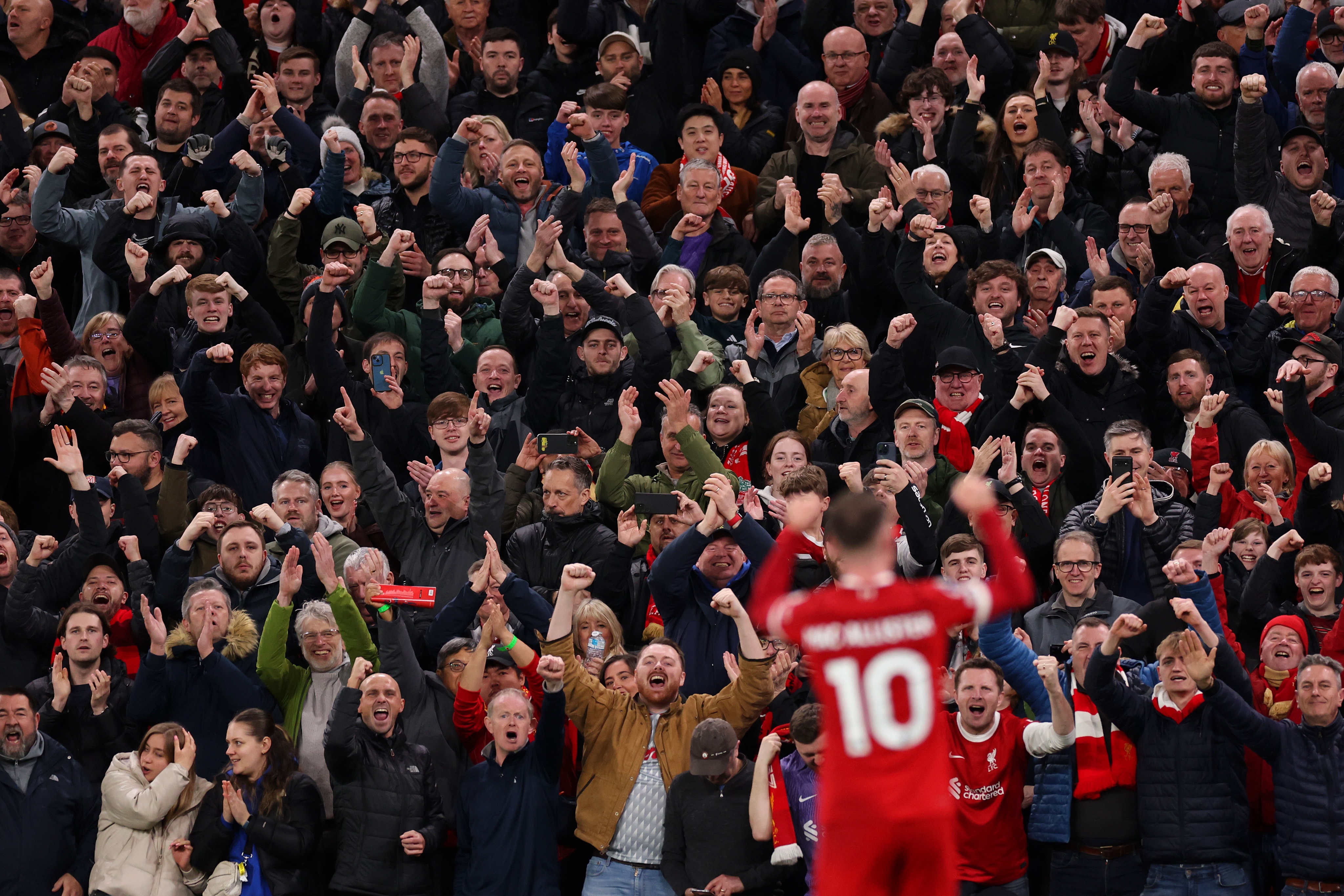 Liverpool fans celebrate Alexis Mac Allister's strike against Sheffield Utd. 