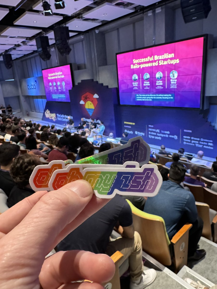 robbyrussell's tweet photo. If you’re at @tropical_rb and use @ohmyzsh…I got these on me. Come say hi and get a sticker 🙃 https://t.co/AUjjf2tVRZ