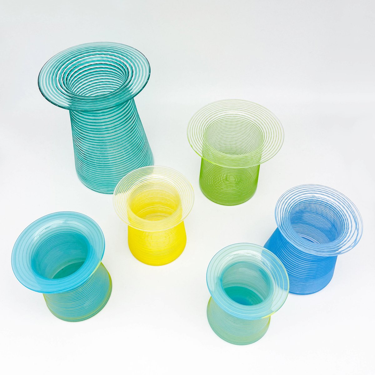 We just received 21 new hand blown glass vessels by David Benyosef, including these colorful vases - stop by to see the rest! 13forest.com/davidbenyosef/