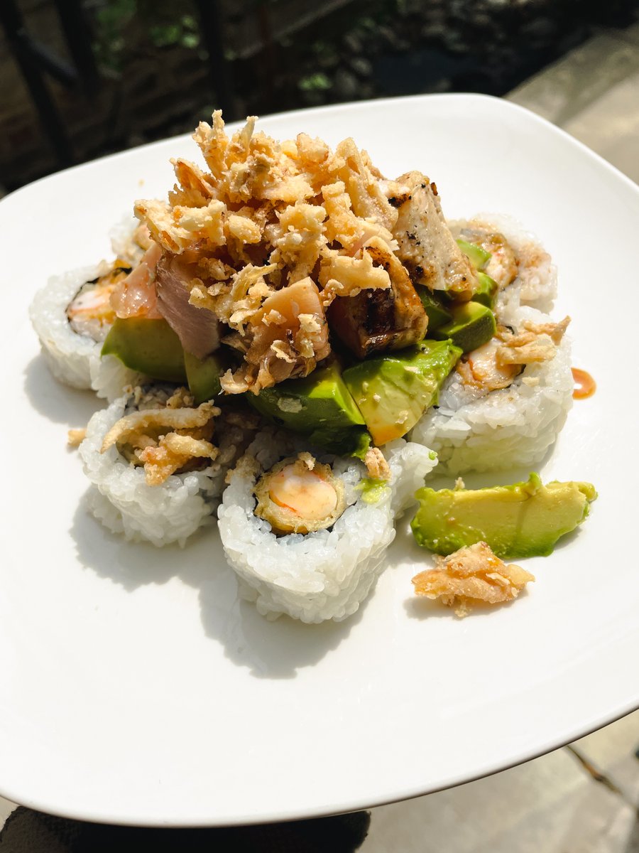 Topped with albacore tuna, crispy onions, and all the AVOCADO GOODNESS, this Hotty Toddy Roll from Yogi's Sushi Bar in Dallas does not miss a beat! 🔥 #AlwaysGood #Sushi #AvocadoRoll