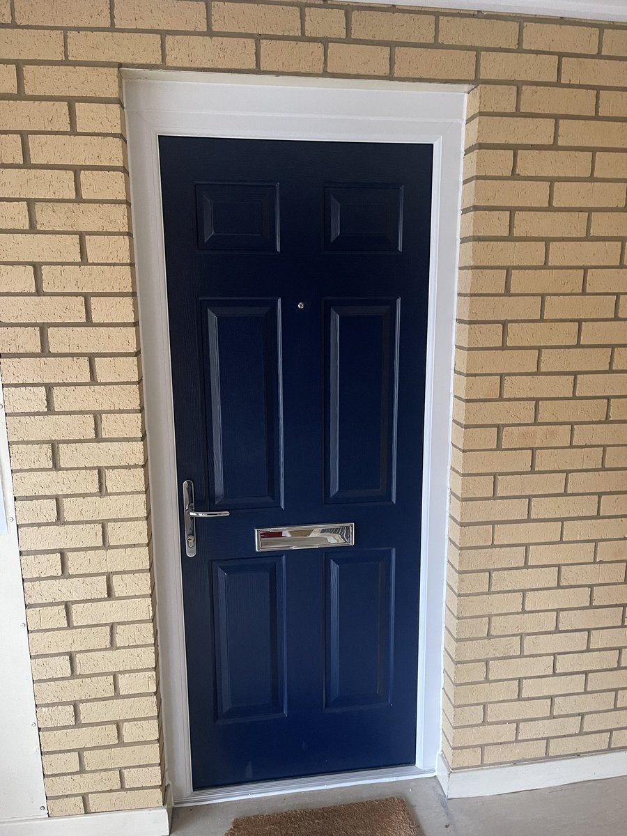 Replacement wooden fire rated door in a flat with a composite fire rated door in East Lothian.