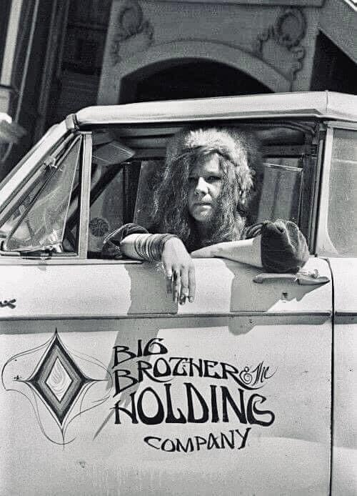 Janis Joplin .. behind the wheel of the Big Brother & the Holding  Company's early convertible circa 1967.  Not exactly sure what make it was, but the Classic 'Gods Eye' was hand painted BBHC graphics on the door done by Stanley Mouse .. remember seeing it all over town back in