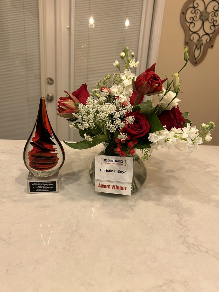 A lovely evening at the @universityofga research award banquet, with the coolest sculpture award (that also makes a nice teardrop!) and featuring the awesome Dean Auer and Associate Dean Maltese from @UGA_SPIA! A huge honor and tons of fun!