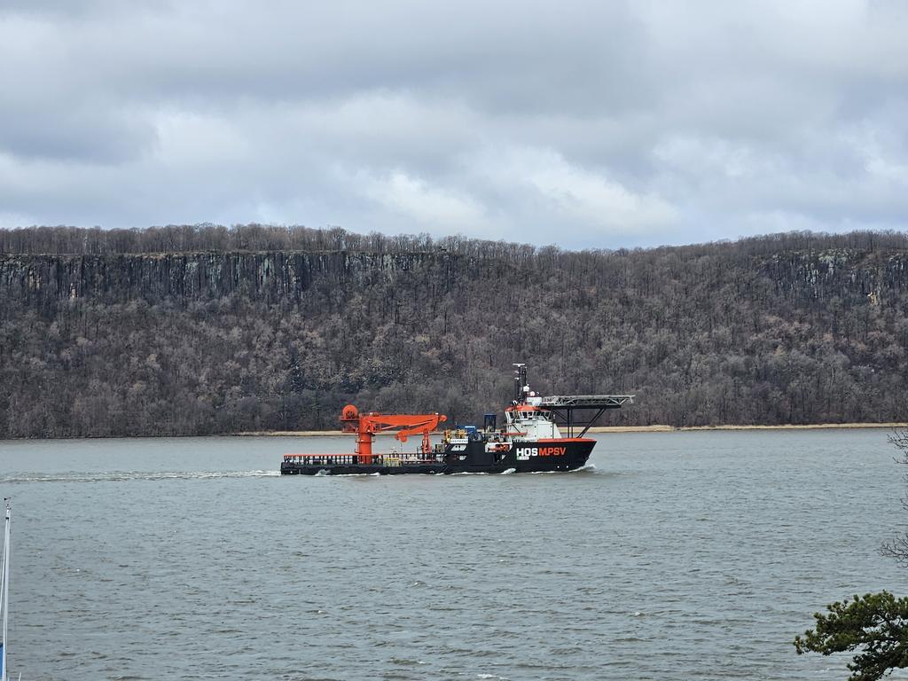 Seen on the Hudson: a specialized work boat designed for offshore oil operations. It can run submersibles and do other sea floor work. I assume it is involved in the planned cable laying project. That's a helicopter landing pad over the bow!