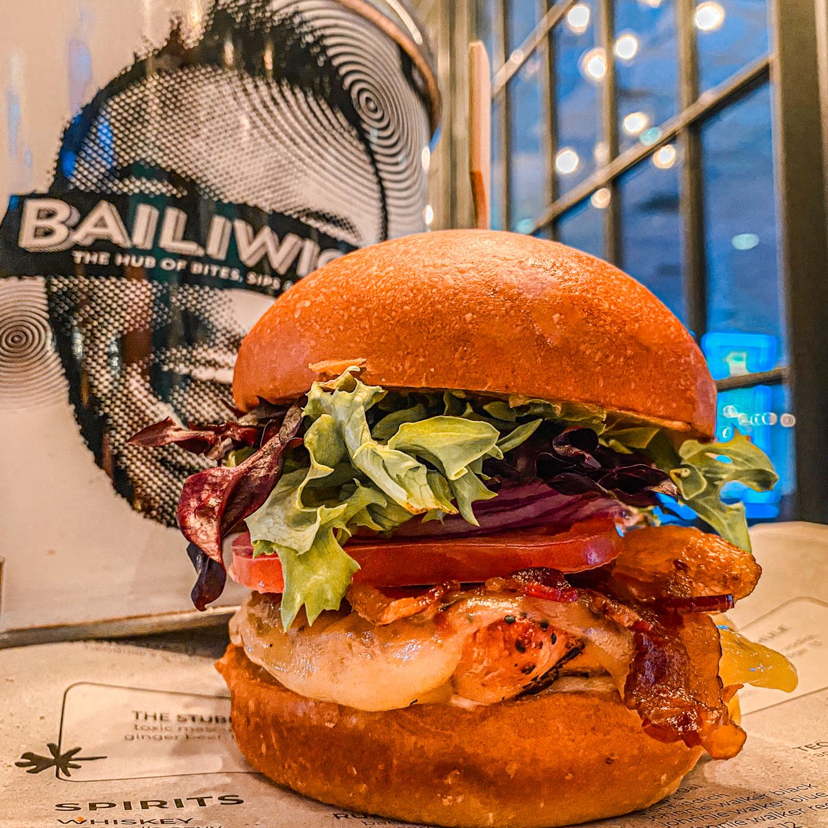 Here's something to whet your appetite for Rockabilly. Bailiwick is rolling out a ROCK N' CHICKEN BURGER for the iconic weekend! Grilled chicken piled high with cheese, bacon, avocado, tomato, onions and mixed greens. 🐔 Make sure you come here hungry!